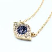 EVIL EYE Pendant Necklace detailed in Swarovski Blue setting Gold